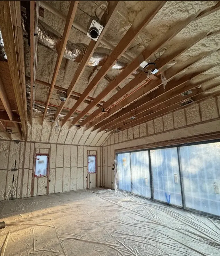 Interior walls and ceiling insulated with spray foam during new construction in Ontario